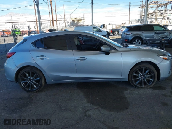 2018 Mazda 3 Touring with VIN 3MZBN1L31JM163466, listed as a IAAI auction lot 40777124 with 101,497 mi miles and . Bid and sale history available at carsss.com. Image 12.