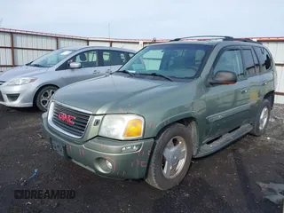 2003 GMC Envoy SLT with VIN 1GKDT13SX32161898, listed as a IAAI auction lot 41642072 with 230,154 mi miles. Bid and sale history available at carsss.com. Image 2.