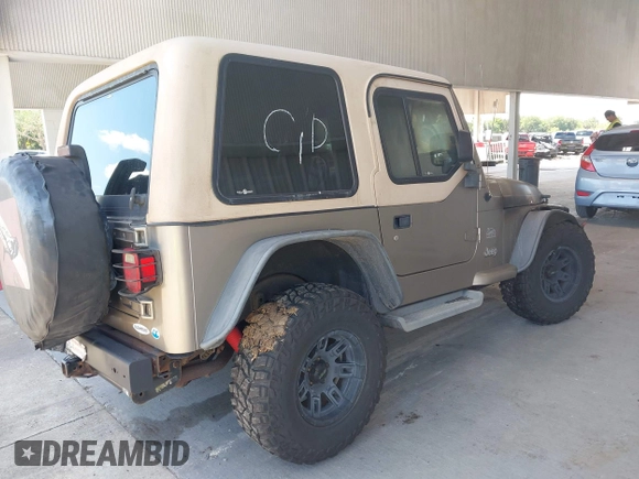 2003 Jeep Wrangler Sahara z VIN 1J4FA59S63P336928, wystawiony jako IAAI lot #42254314 z przebiegiem Nie podano mil oraz . Historia ofert i sprzedaży dostępna na DreamBid. Obrazek 4.