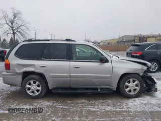 2005 GMC Envoy SLT with VIN 1GKDT13S352258640, listed as a IAAI auction lot 41226997 with 159,665 mi miles. Bid and sale history available at carsss.com. Image 13.