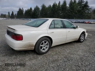 2000 Cadillac Seville Touring STS z VIN 1G6KY5497YU191639, wystawiony jako Copart lot #49658115 z przebiegiem 82 725 mil mil oraz Szkoda całkowita • Salvage title. Historia ofert i sprzedaży dostępna na DreamBid. Obrazek 3.