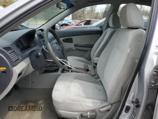 2004 Kia Spectra LX with VIN KNAFE121245031019, listed as a Copart auction lot 52960135 with 183,016 mi miles and Salvage Title. Bid and sale history available at carsss.com. Image 7.