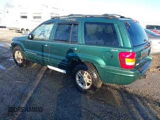 1999 Jeep Grand Cherokee Limited with VIN 1J4GW68S1XC555399, listed as a IAAI auction lot 41764099 with 1 mi miles. Bid and sale history available at carsss.com. Image 3.