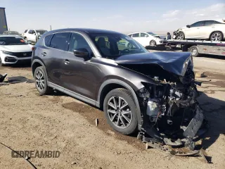 2018 Mazda CX-5 Grand Touring with VIN JM3KFADMXJ1323646, listed as a Copart auction lot 46857825 with 62,262 mi miles and Salvage title. Bid and sale history available at DreamBid. Image 4.