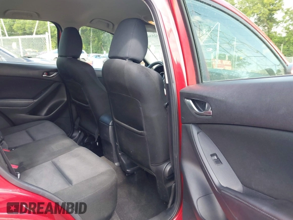 2015 Mazda CX-5 Sport with VIN JM3KE2BE8F0451014, listed as a IAAI auction lot 42536333 with 131,059 mi miles and . Bid and sale history available at DreamBid. Image 8.