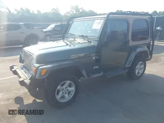2002 Jeep Wrangler X with VIN 1J4FA39S72P733034, listed as a IAAI auction lot 42659447 with 200,786 mi miles and . Bid and sale history available at DreamBid. Image 2.