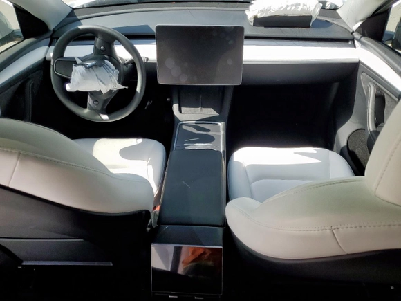 2024 Tesla Model Y Long Range z VIN 7SAYGDEE0RA313929, wystawiony jako Copart lot #59548725 z przebiegiem Nie podano mil oraz Szkoda całkowita • Salvage title. Historia ofert i sprzedaży dostępna na DreamBid. Obrazek 8.