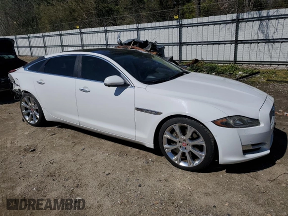 2016 Jaguar XJ Portfolio with VIN SAJWA2G70G8W01136, listed as a Copart auction lot 50120455 with 92,224 mi miles and Salvage title. Bid and sale history available at DreamBid. Image 4.
