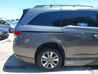 2015 Honda Odyssey Touring Elite z VIN 5FNRL5H99FB017517, wystawiony jako IAAI lot #42246066 z przebiegiem 104 878 mil mil oraz . Historia ofert i sprzedaży dostępna na DreamBid. Obrazek 19.