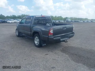 2014 Toyota Tacoma with VIN 5TFLU4EN9EX099414, listed as a IAAI auction lot 40528514 with 122,827 mi miles. Bid and sale history available at carsss.com. Image 3.