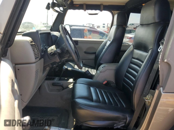 2004 Jeep Wrangler Rubicon with VIN 1J4FA69S64P751349, listed as a Copart auction lot 69642624 with 160,589 mi miles and Salvage Title. Bid and sale history available at carsss.com. Image 7.