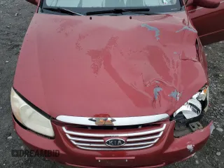 2007 Kia Spectra EX with VIN KNAFE121X75381938, listed as a Copart auction lot 74341004 with 118,890 mi miles and Salvage Title. Bid and sale history available at carsss.com. Image 11.