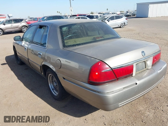 2002 Mercury Grand Marquis LS Premium z VIN 2MEFM75W32X636872, wystawiony jako IAAI lot #41717410 z przebiegiem 88 840 mil mil oraz . Historia ofert i sprzedaży dostępna na DreamBid. Obrazek 3.