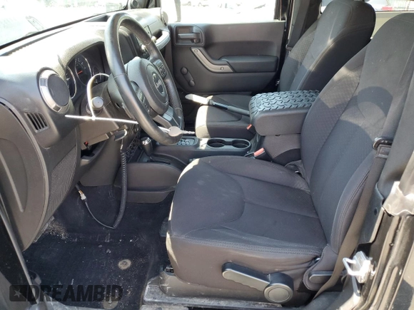 2014 Jeep Wrangler Sport with VIN 1C4AJWAG2EL113843, listed as a Copart auction lot 62771115 with 70,089 mi miles and Salvage title. Bid and sale history available at DreamBid. Image 7.