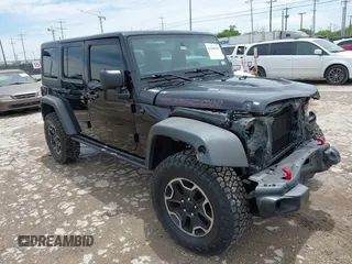 2014 Jeep Wrangler Unlimited Rubicon with VIN 1C4HJWFG6EL308142, listed as a IAAI auction lot 42388395 with 159,083 mi miles and . Bid and sale history available at DreamBid. Image 1.