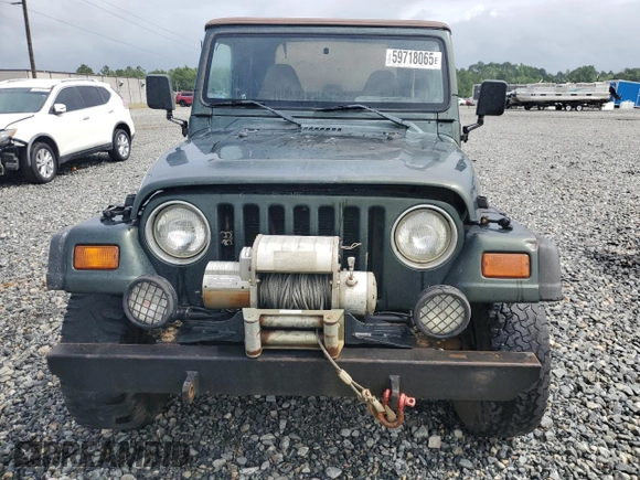 1998 Jeep Wrangler Sport with VIN 1J4FY19S5WP795781, listed as a Copart auction lot 59718065 with 208,416 mi miles and Salvage title. Bid and sale history available at DreamBid. Image 5.
