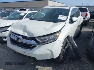 2017 Honda CR-V Touring with VIN 2HKRW1H96HH517669, listed as a IAAI auction lot 41653040 with 97,961 mi miles. Bid and sale history available at carsss.com. Image 2.
