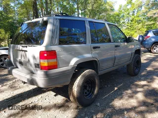 1998 Jeep Grand Cherokee Laredo with VIN 1J4GZ58S6WC154415, listed as a IAAI auction lot 42331831 with 163,723 mi miles and . Bid and sale history available at DreamBid. Image 4.