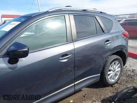 2016 Mazda CX-5 Touring with VIN JM3KE4CY9G0915305, listed as a IAAI auction lot 41840519 with 188,702 mi miles and . Bid and sale history available at carsss.com. Image 14.