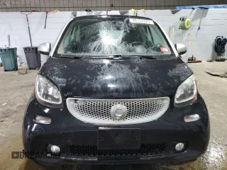 2016 Smart fortwo Passion z VIN WMEFJ5DA9GK067011, wystawiony jako Copart lot #46152325 z przebiegiem 61 195 mil mil oraz Szkody całkowita. Historia ofert i sprzedaży dostępna na DreamBid. Obrazek 5.