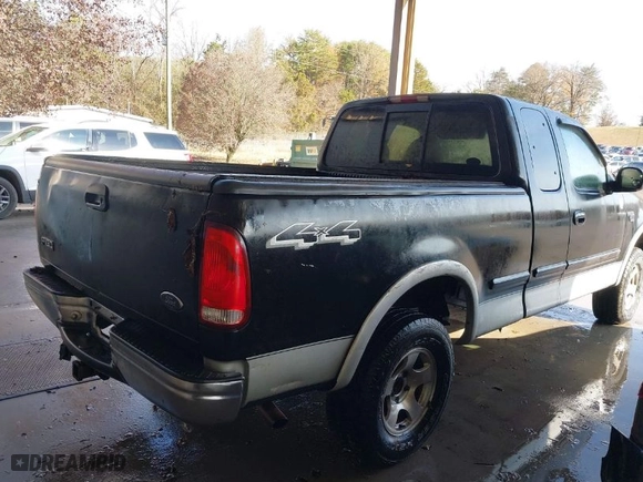 2000 Ford F-150 XL with VIN 1FTRX18LXYNA19385, listed as a IAAI auction lot 41075391 with 214,624 mi miles. Bid and sale history available at carsss.com. Image 4.