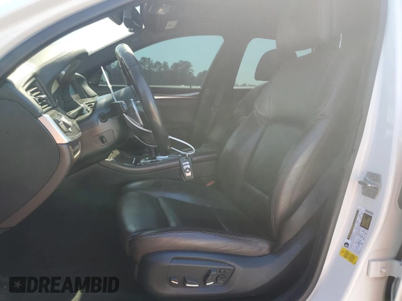 2016 BMW 5 Series 550i with VIN WBAKN9C59GD963159, listed as a Copart auction lot 50718175 with 113,715 mi miles and Salvage title. Bid and sale history available at DreamBid. Image 7.