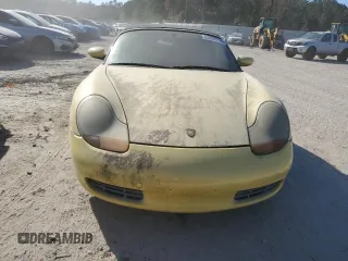 1998 Porsche Boxster z VIN WP0CA2982WU623104, wystawiony jako Copart lot #83398714 z przebiegiem Nie podano mil oraz Czysty tytuł • Clean title. Historia ofert i sprzedaży dostępna na DreamBid. Obrazek 5.
