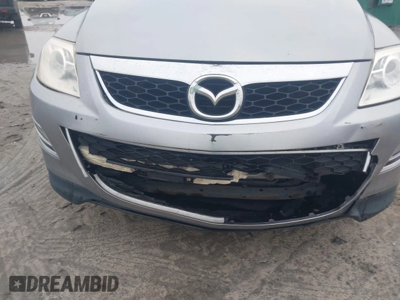 2012 Mazda CX-9 Grand Touring z VIN JM3TB2DA5C0363864, wystawiony jako IAAI lot #41896080 z przebiegiem 287 420 mil mil oraz . Historia ofert i sprzedaży dostępna na DreamBid. Obrazek 6.
