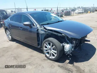 2014 Mazda 6 i Touring with VIN JM1GJ1T62E1136813, listed as a IAAI auction lot 42529521 with 137,730 mi miles and . Bid and sale history available at DreamBid. Image 1.