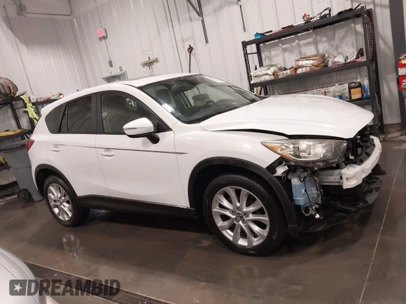 2015 Mazda CX-5 Grand Touring with VIN JM3KE4DY4F0495627, listed as a IAAI auction lot 41887773 with 130,421 mi miles. Bid and sale history available at carsss.com. Image 14.