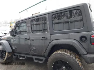 2020 Jeep Wrangler Unlimited Sport z VIN 1C4HJXDN3LW164701, wystawiony jako IAAI lot #41200437 z przebiegiem 102 272 mil mil oraz . Historia ofert i sprzedaży dostępna na DreamBid. Obrazek 14.