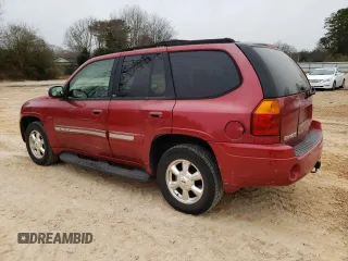 2004 GMC Envoy SLT with VIN 1GKDT13S342262833, listed as a Copart auction lot 87828975 with 203,404 mi miles and Salvage Title. Bid and sale history available at carsss.com. Image 2.