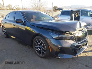 2024 BMW i5 eDrive40 with VIN WBY33FK09RCR42126, listed as a IAAI auction lot 41370577 with 9,601 mi miles and . Bid and sale history available at DreamBid. Image 1.