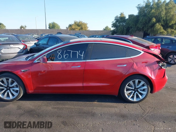 2018 Tesla Model 3 Long Range Battery with VIN 5YJ3E1EA3JF035785, listed as a IAAI auction lot 41986774 with 33,965 mi miles and . Bid and sale history available at DreamBid. Image 14.