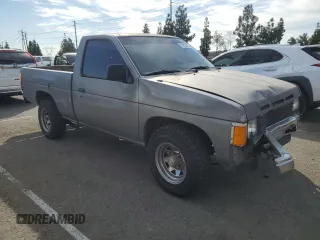 1987 Nissan Hardbody E z VIN JN6ND11SXHW014073, wystawiony jako Copart lot #78956934 z przebiegiem 381 885 mil mil oraz Szkody całkowita. Historia ofert i sprzedaży dostępna na DreamBid. Obrazek 4.