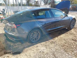 2023 Tesla Model 3 with VIN 5YJ3E1EA3PF673642, listed as a IAAI auction lot 40818151 with 12,293 mi miles and . Bid and sale history available at carsss.com. Image 4.