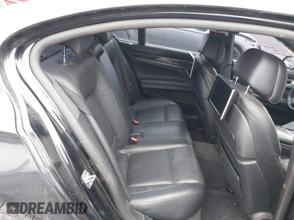 2015 BMW 7 Series 750i xDrive with VIN WBAYB6C59FD965820, listed as a IAAI auction lot 41558215 with 142,617 mi miles. Bid and sale history available at carsss.com. Image 8.