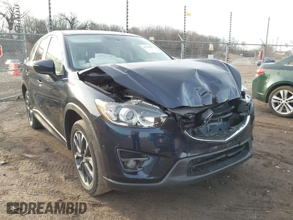2016 Mazda CX-5 Grand Touring with VIN JM3KE4DY1G0823989, listed as a IAAI auction lot 41770149 with 40,677 mi miles. Bid and sale history available at carsss.com. Image 1.