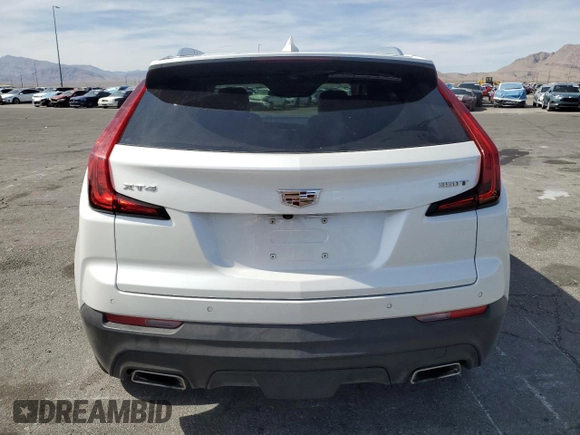 2023 Cadillac XT4 FWD Luxury with VIN 1GYAZAR46PF134602, listed as a Copart auction lot 54684865 with 13,221 mi miles and Salvage title. Bid and sale history available at DreamBid. Image 6.