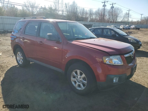 2010 Mazda Tribute Touring with VIN 4F2CY9C77AKM04941, listed as a Copart auction lot 50802955 with 118,480 mi miles and Salvage Title. Bid and sale history available at carsss.com. Image 4.