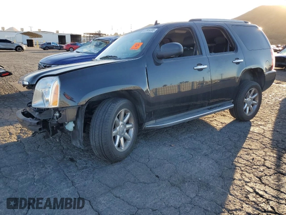 2013 GMC Yukon Denali with VIN 1GKS1EEF0DR205906, listed as a Copart auction lot 87969385 with 128,283 mi miles and Salvage Title. Bid and sale history available at carsss.com. Image 1.