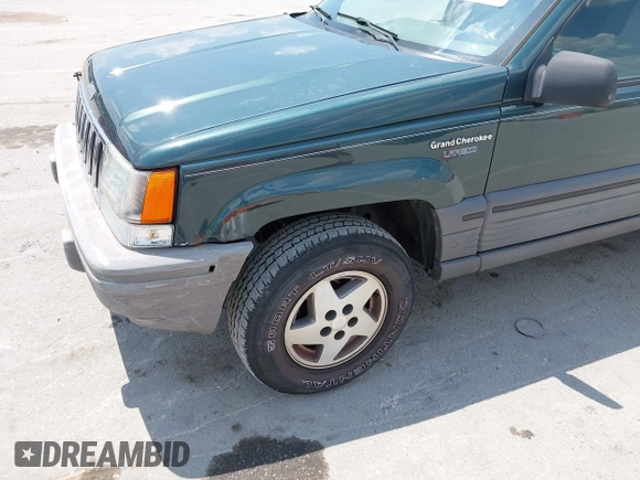 1995 Jeep Grand Cherokee Laredo with VIN 1J4FX58S0SC716398, listed as a IAAI auction lot 42647346 with 58,184 mi miles and . Bid and sale history available at DreamBid. Image 6.