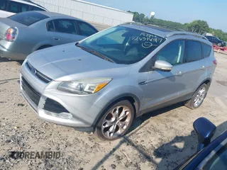 2013 Ford Escape Titanium with VIN 1FMCU0J94DUB58785, listed as a IAAI auction lot 42631897 with 163,037 mi miles and . Bid and sale history available at DreamBid. Image 2.