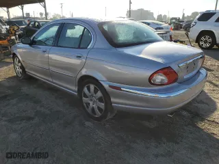 2005 Jaguar X-Type 3.0L with VIN SAJWA51C55WE31701, listed as a Copart auction lot 82908594 with 186,332 mi miles and Salvage Title. Bid and sale history available at carsss.com. Image 2.