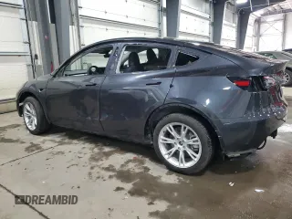 2024 Tesla Model Y Long Range with VIN 7SAYGDEE6RA253946, listed as a Copart auction lot 46699445 with 6,008 mi miles and Salvage Title. Bid and sale history available at DreamBid. Image 2.
