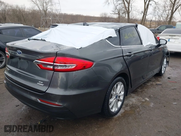2020 Ford Fusion SE z VIN 3FA6P0LU6LR185721, wystawiony jako IAAI lot #41639827 z przebiegiem 63 857 mil mil oraz . Historia ofert i sprzedaży dostępna na DreamBid. Obrazek 4.