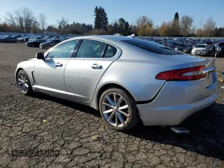 2015 Jaguar XF V6 Portfolio with VIN SAJWA0F7XF8U51105, listed as a Copart auction lot 82865814 with 62,807 mi miles and Salvage Title. Bid and sale history available at carsss.com. Image 2.