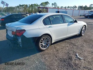 2014 BMW 7 Series ALPINA B7 with VIN WBAYE8C59ED134562, listed as a IAAI auction lot 41806222 with 120,043 mi miles. Bid and sale history available at carsss.com. Image 4.