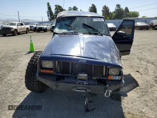 2000 Jeep Cherokee with VIN 1J4FF48S3YL126931, listed as a Copart auction lot 57593305 with Not provided miles and Non repairable. Bid and sale history available at DreamBid. Image 5.