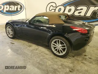 2007 Pontiac Solstice z VIN 1G2MB35B17Y128125, wystawiony jako Copart lot #56049485 z przebiegiem 167 817 mil mil oraz Czysty tytuł • Clean title. Historia ofert i sprzedaży dostępna na DreamBid. Obrazek 2.